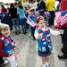 Girl Scout troop 40375 member Marissa Fransik, 6, stands with flags and other attire before the parade on Monday, May 27. Daniel Brenner I AnnArbor.com